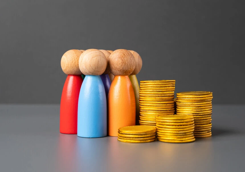 Lead scoring and qualification in the financial sector. Colorful wooden figures representing customer segmentation alongside growing stacks of coins symbolising increased revenue from qualified credit and insurance leads.